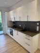 Moderne 2-Zimmer-Wohnung in Niederrad - Küche mit EBK