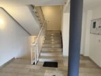 Wohnen oder investieren – 2-Zimmer-Wohnung mit Balkon und Garage in Oberursel OT Weißkirchen - Hausflur